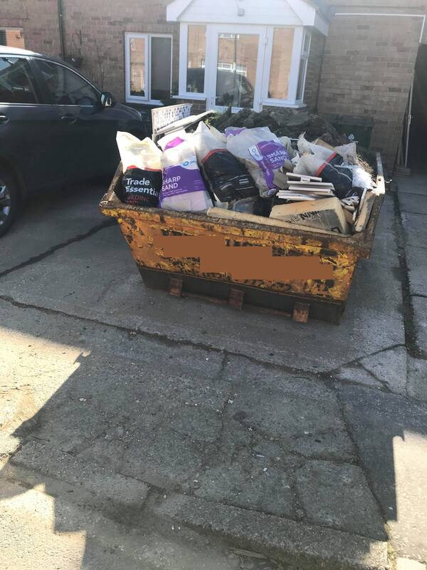 Builders skip loaded with waste in Crawley